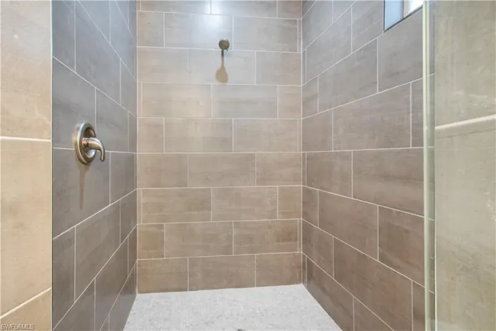 Bathroom featuring a tile shower