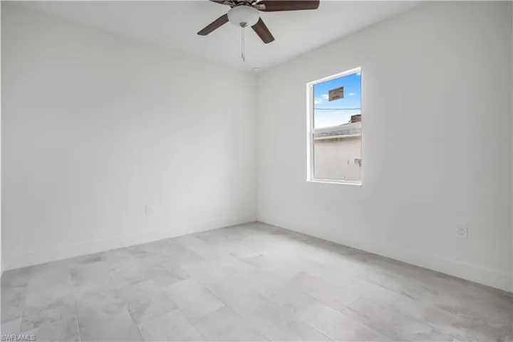 Spare room featuring ceiling fan