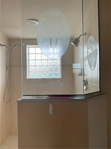 Master Bathroom featuring a tile shower