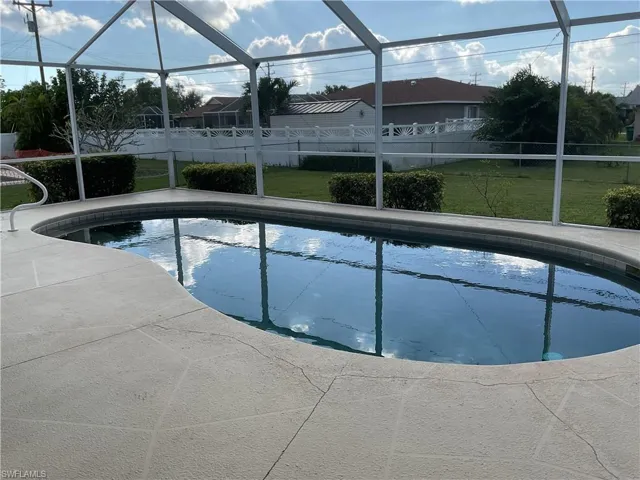 View of swimming pool with screen enclosure