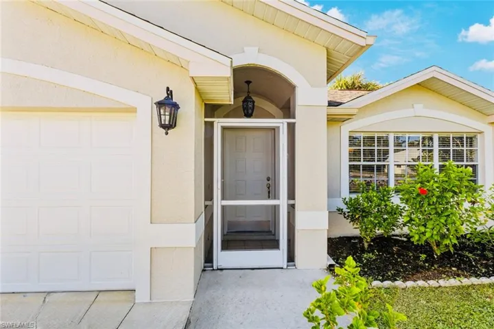 Property entrance featuring stucco exterior