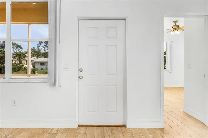 Foyer featuring light wood-style tile flooring and a ceiling fan
