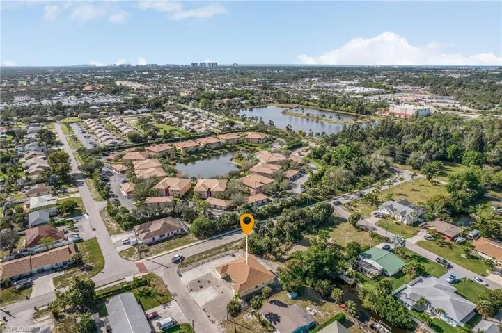 Aerial view of property's location featuring nearby suburban area