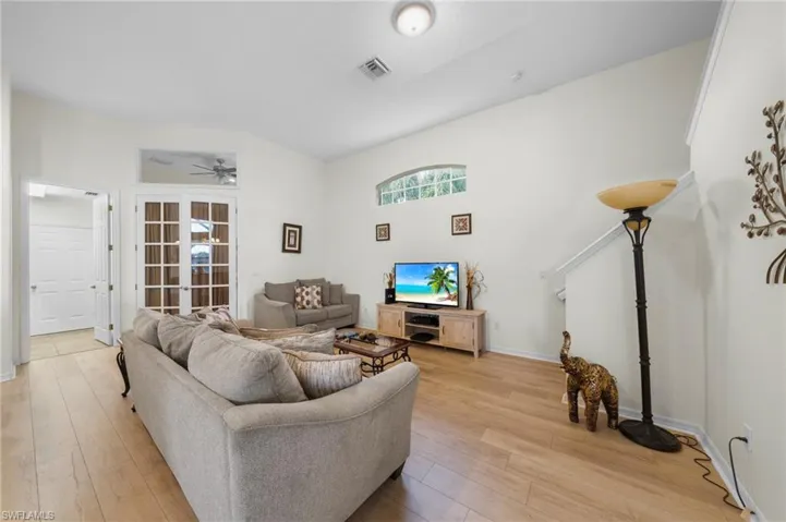 Living area featuring light wood finished floors and a ceiling fan