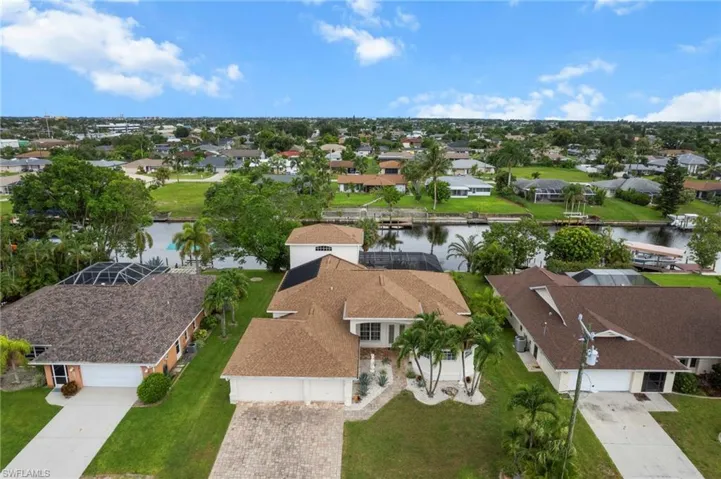 Aerial perspective of suburban area with a large body of water
