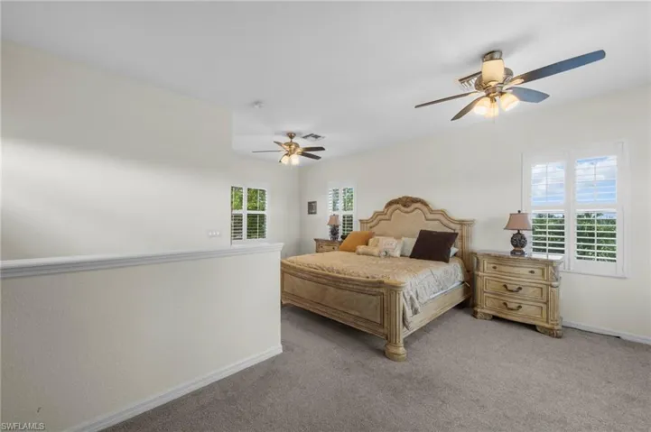 Bedroom featuring carpet flooring and a ceiling fan