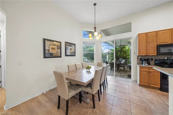 Dining room with a chandelier and a high ceiling
