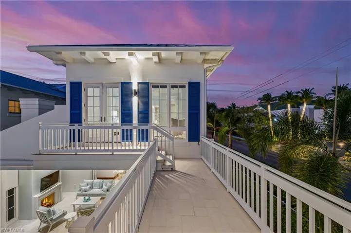 Balcony at dusk with an outdoor hangout area