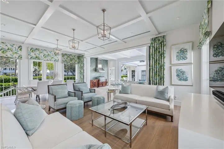 Sunroom / solarium featuring beam ceiling and coffered ceiling