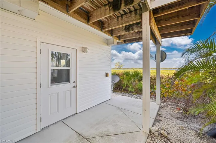 Service Door to Garage and Storage area