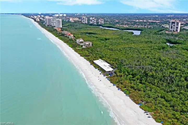 Drone / aerial view featuring a view of the beach and a water view