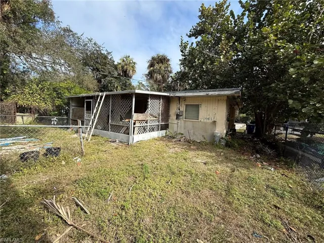 View of front of house with a wooden deck