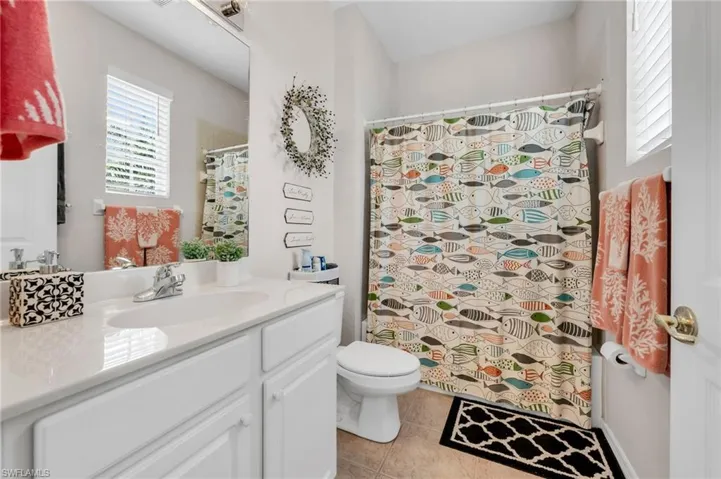 Modern fixtures and creative tilework make this a standout second bath.