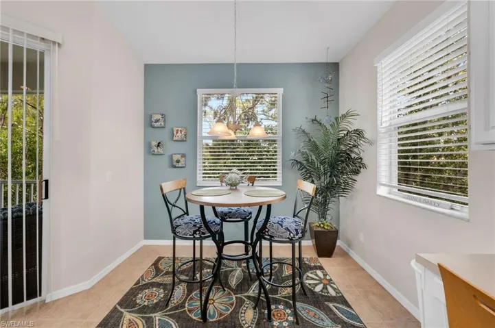 Enjoy morning coffee with tranquil views from this sunlit breakfast area.