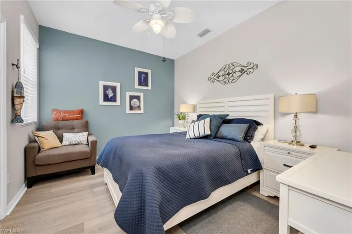 Well-sized guest bedroom with ample light and relaxing atmosphere.