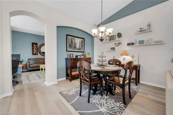 Dedicated dining space with modern lighting and charming architectural details.