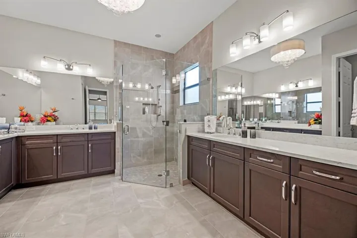 Bathroom featuring walk in shower and vanity