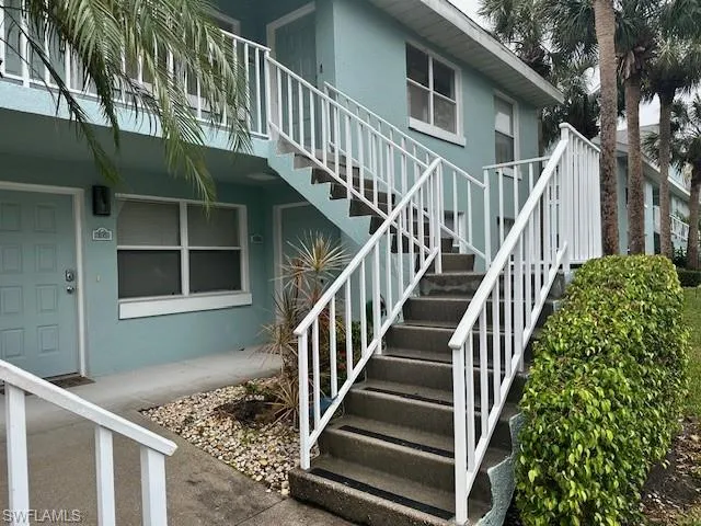 Tucked behind the stairway - first floor entry to your Naples paradise