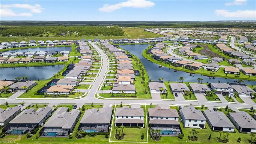 Aerial view of residential area with a large body of water