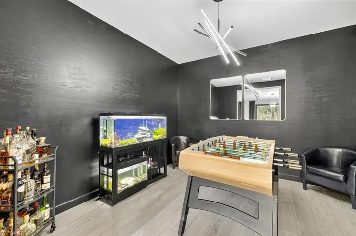 Recreation room featuring wood finished floors