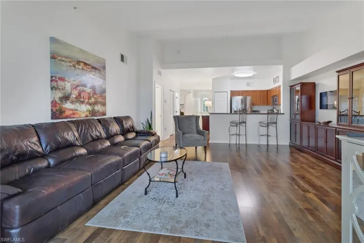 Living room featuring dark wood-type flooring