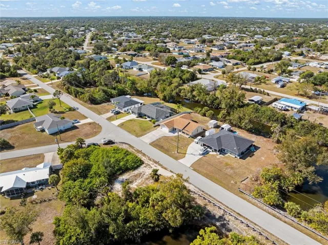 View of property location with nearby suburban area
