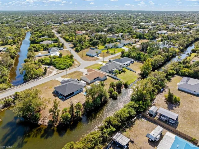 Aerial overview of property's location with nearby suburban area