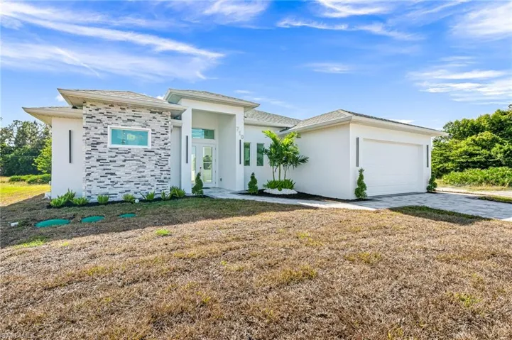 Prairie-style home with a garage
