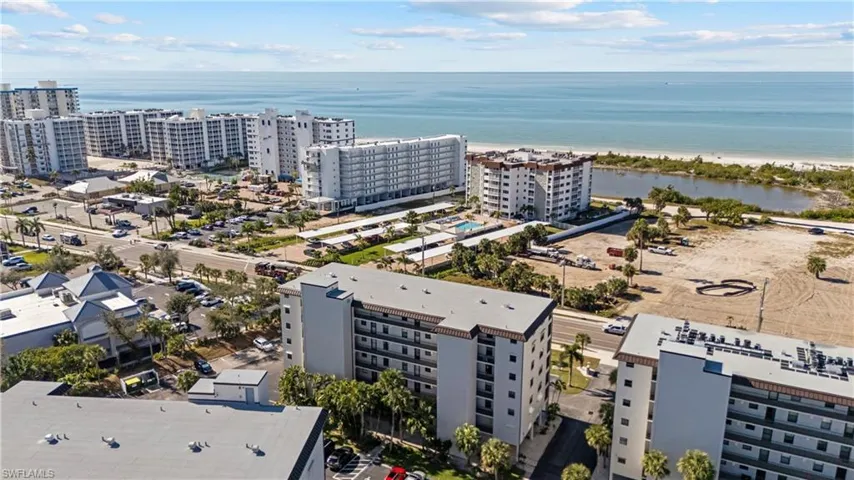 View of urban area with a large body of water and apartment complex / building