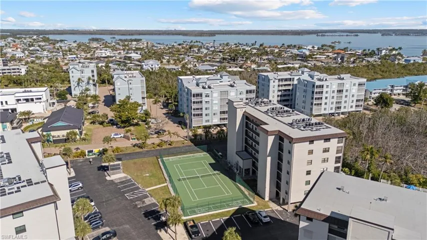 Aerial view of apartment complex and a nearby body of water