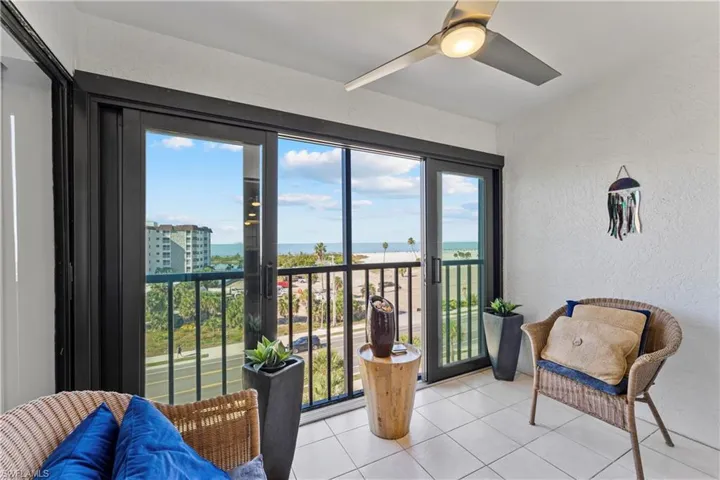 Sunroom / solarium with a water view