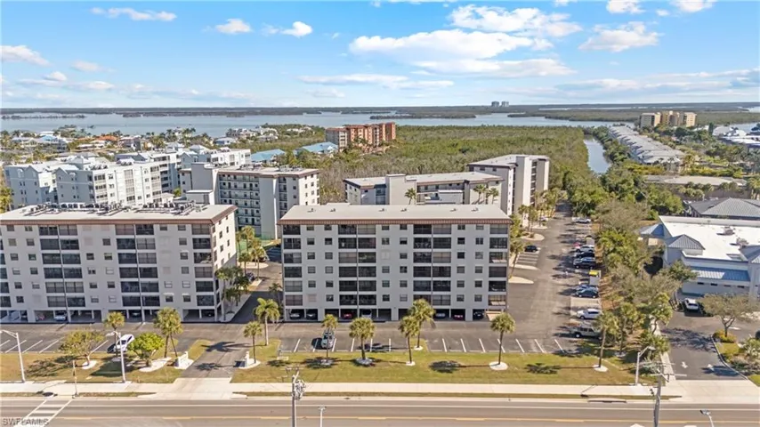 Drone / aerial view of a large body of water and apartment complex