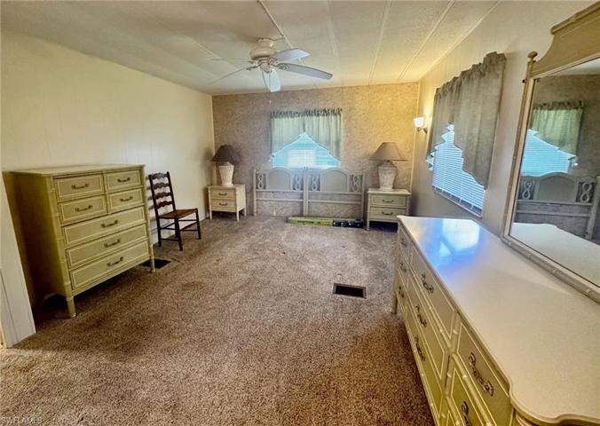 Neutral carpet & ceiling fan in the Master Bedroom.