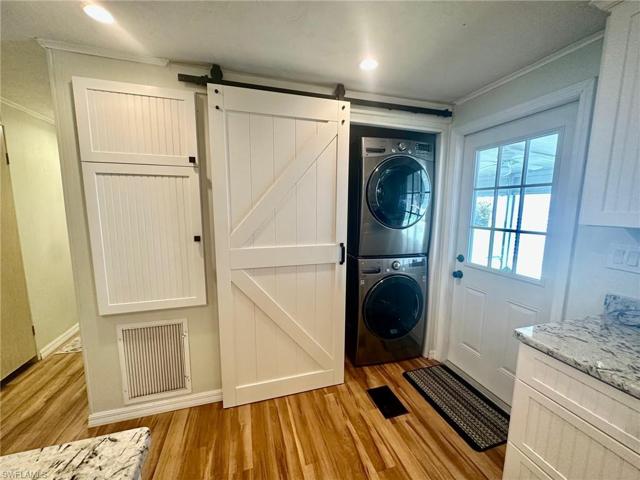 FULL SIZE Washer & Dryer conveniently located in the Kitchen.
