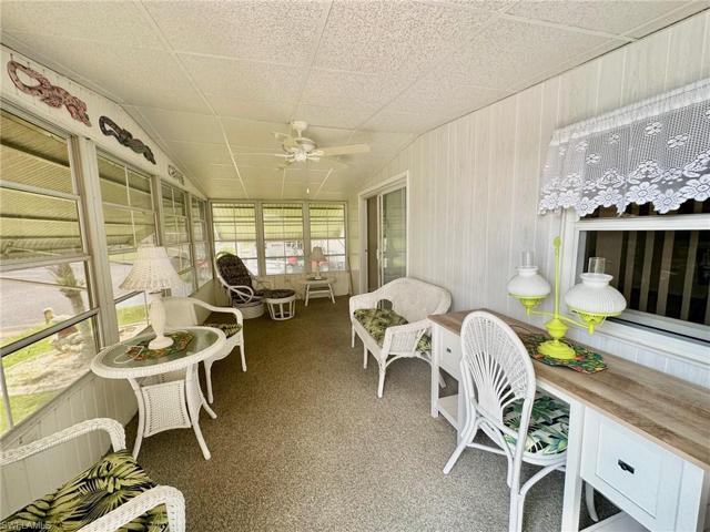 Florida Room with neutral carpet and ceiling fan provides additional space for entertaining!