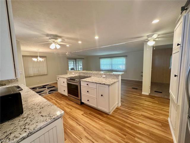 Stainless steel appliances include glass top stove, Dishwasher & Fridge w/ice-maker.