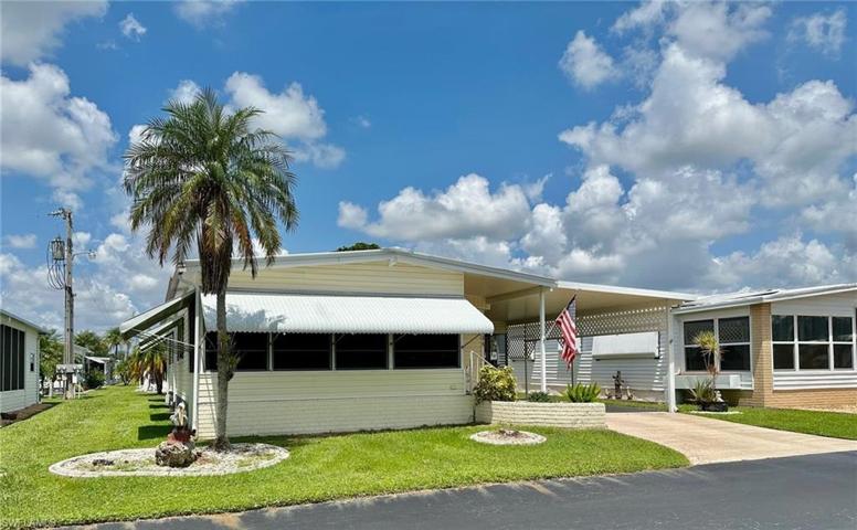IDEALLY LOCATED near the well-kept amenities in Lazy Days Village with extra parking for your guests.