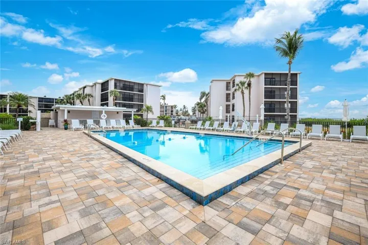Community pool featuring a patio
