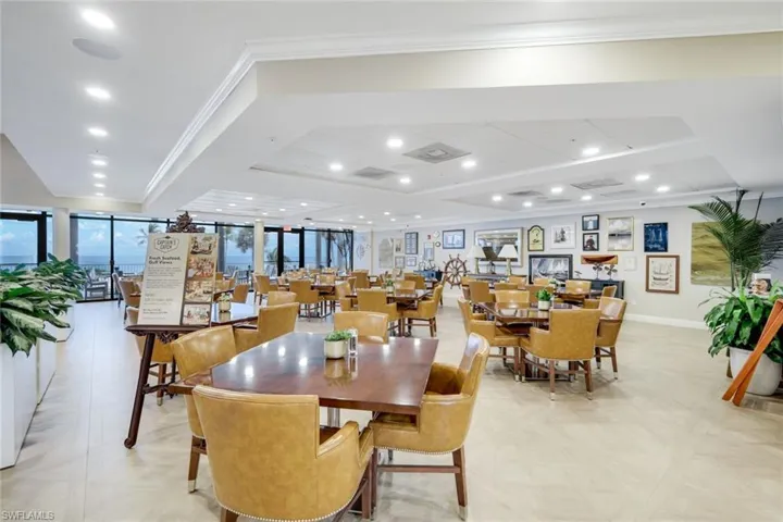 Dining space featuring ornamental molding, recessed lighting, and parquet flooring
