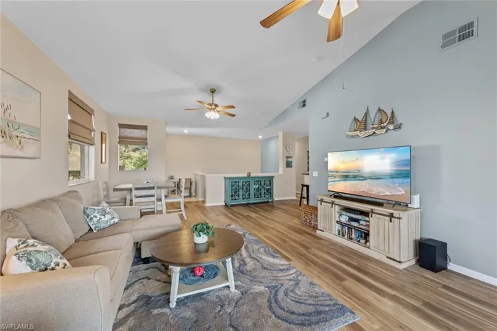 Living room featuring light wood-style flooring and ceiling fan