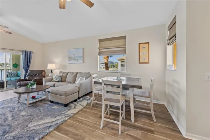 Living area featuring light wood-style flooring and a ceiling fan