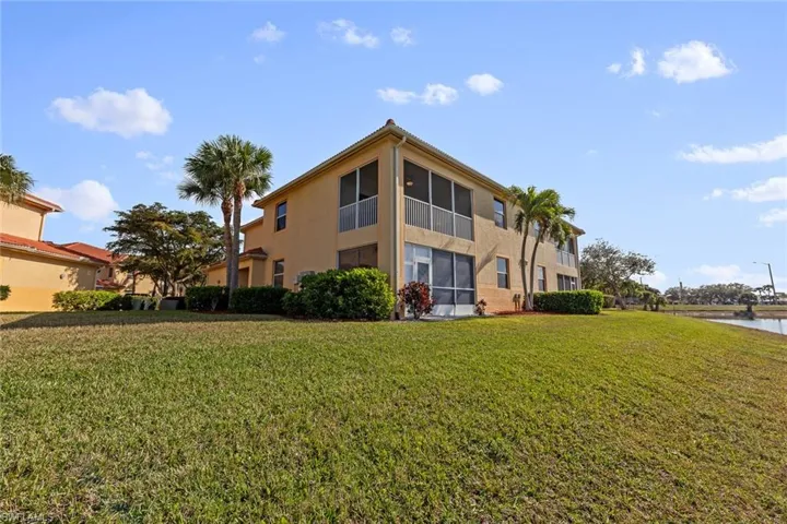View of property with a water view