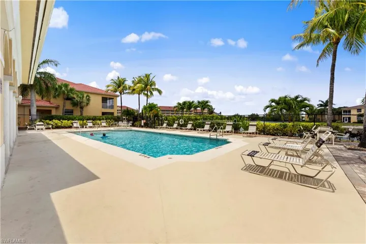 Community pool with a patio area
