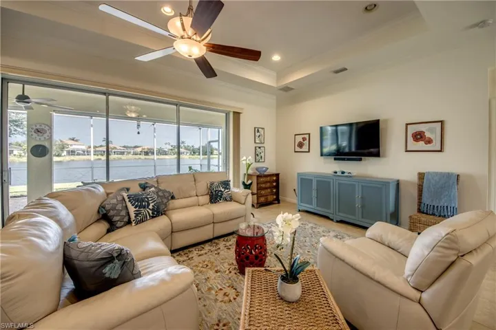 Open Concept LR W/Water View, Crown Molding, Tray Ceiling & Fan