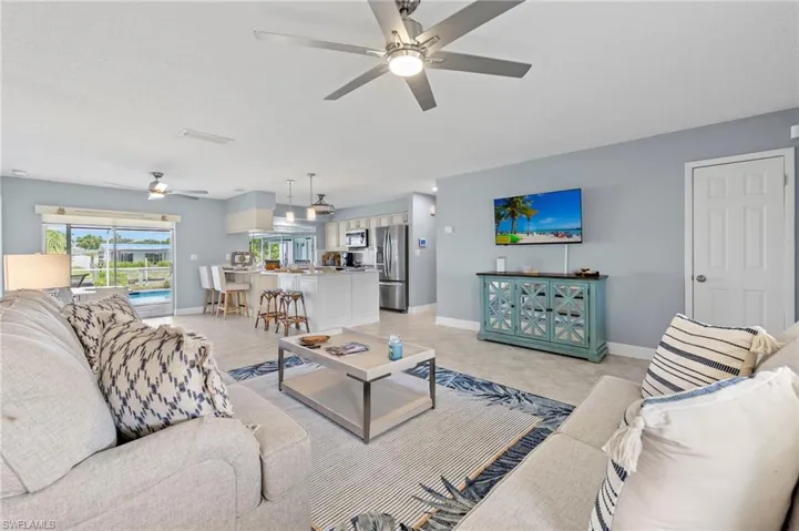 Tiled living room with ceiling fan