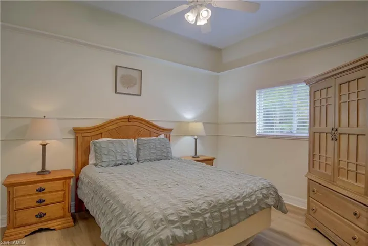 Bedroom featuring light wood-type flooring and ceiling fan