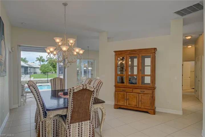 Dining room featuring a chandelier and light tile patterned floors