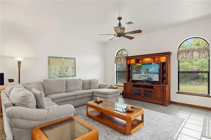 Tiled living room with ceiling fan
