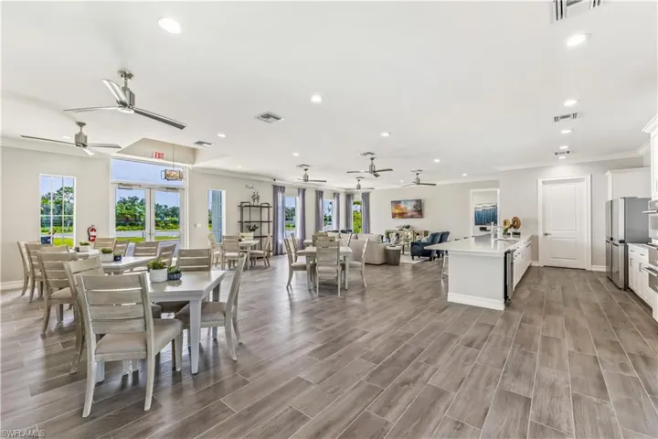 Dining space featuring crown molding, ceiling fan, and hardwood / wood-style floors