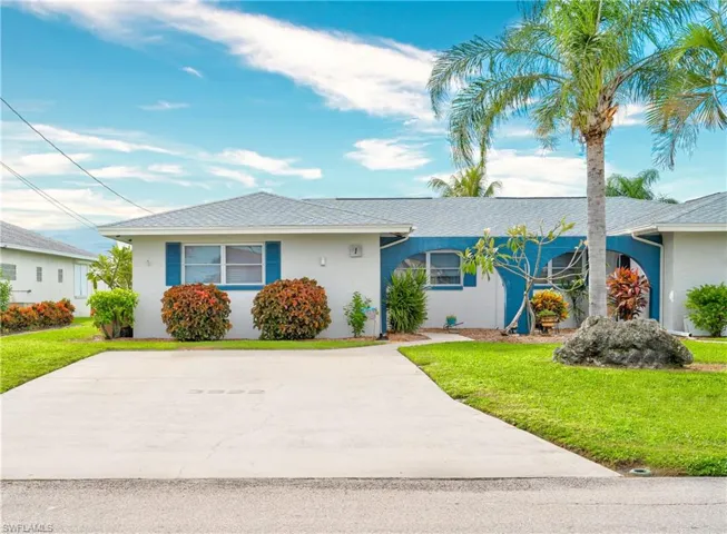 Ranch-style home with a front lawn